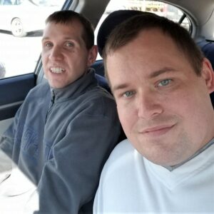 photo of Kyle and Kevin sitting in the front seat of a car