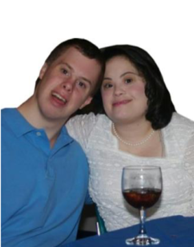Couple smiling together with a glass of wine