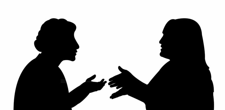 28247708 - black silhouettes of two women, talking to each other